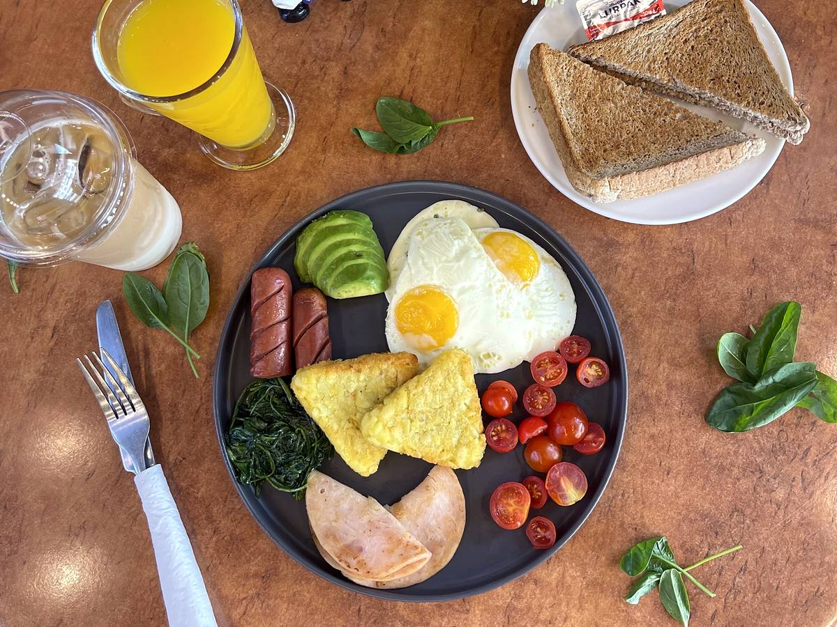 Breakfast Combo: fried eggs, avocado, sausage, hash browns, turkey, brown toast and orange juice