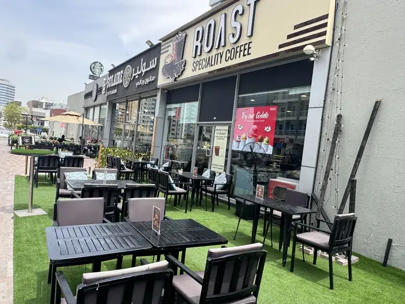 ROAST Specialty Coffee shopfront at Dubai Silicon Oasis with terrace tables outside